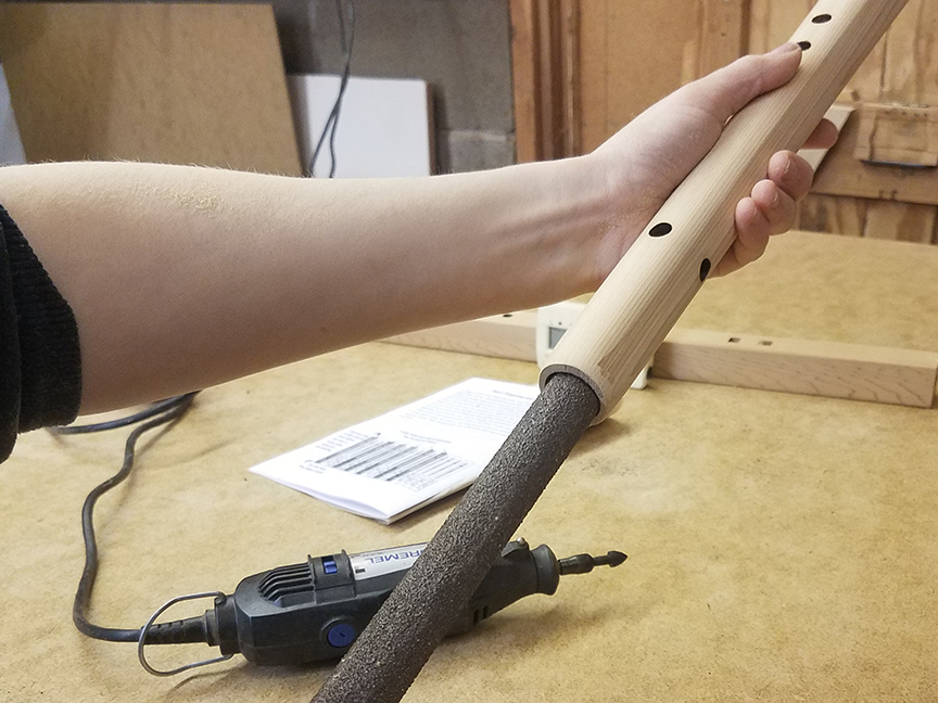 Sanding the bore of a Native American flute - www.stellarflutes.com